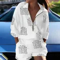 Detail view of women's white two-piece set with black script print and ring zipper. - S / Top And Bottom / Believe In Yourself