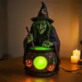 Decorative Halloween witch stirring a glowing green cauldron resin lantern sculpture - Cauldron Witch / Button Battery Version