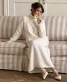 Elegant white wool blend knit two-piece set featuring turtleneck sweater and long skirt - Off White