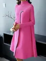 Detailed view of an elegant pink high-neck long-sleeve dress with a large swing skirt. - S / Rose Red
