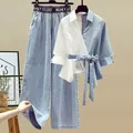 Detail of women's spring set featuring contrast wrap shirt and wide-leg denim pants. - 3XL / Top And Bottom