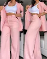 Side and front view of elegant pink blazer and high-waisted wide-leg trousers set - S / Top And Bottom / Pink