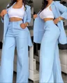 Elegant light blue two-piece blazer set with slit sleeves and wide-leg trousers. - S / Top And Bottom / Light Blue