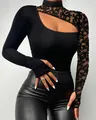 Detail view of asymmetric black long sleeve top with lace shoulder cutout and high neck. - S / Tops / Black