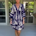 Elegant V-neck printed midi dress with smocked waist and bell sleeves for women - S / Dresses / Blue