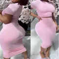 Elegant pink two-piece outfit featuring a short sleeve crop top and bodycon midi skirt - S / Top And Bottom / Pink
