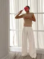 Elegant women's sleeveless round neck knit vest paired with chic white wide-leg trousers - S / Tops / Khaki
