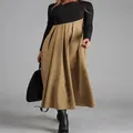 Detail view of long-sleeved color-block maxi dress with irregular pleated waist - S / Khaki