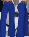 Detalle de pantalones acampanados azul real de cintura alta con cortes de malla en cintura - S / Bottoms / Azul