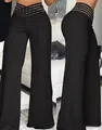 Vista detallada de pantalones acampanados negros de cintura alta con diseño calado - S / Bottoms / Negro