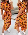 Detailed view of the vibrant orange leopard print dress with side slit and tie waist - Yellow Black Floral Pattern