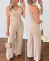 Gedetailleerd vooraanzicht en achteraanzicht van een beige top met V-hals en wijde broek. - S / Boven- En Onderstuk / Broken Wit