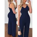 Gedetailleerd voor- en zijaanzicht van de marineblauwe set met crop top en wijde broek - S / Boven- En Onderstuk / Marineblauw