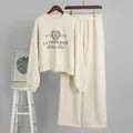 Detail of beige embroidered sweatshirt and wide-leg sweatpants two-piece set for women - S / Top And Bottom / Off White