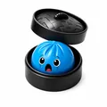 Schattige blauwe verrassing-gezicht dumpling squishy in een zwarte stoommand set - 1 Stuk / Blauw