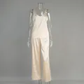 Detailed view of champagne satin pajama set featuring a camisole top and long pants. - S / Top And Bottom / Apricot