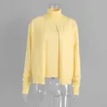 Detailed view of a yellow two-piece knitwear set featuring a turtleneck and cardigan - S / Set / Vest and Cardigan Set / Yellow
