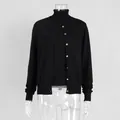 Detail of black two-piece knitwear set with high-neck top and buttoned cardigan. - S / Set / Vest and Cardigan Set / Black