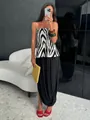 Detail van zwarte tulpen maxi-rok met plooien en elegante split - S / Zwart