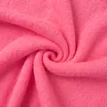 Makroansicht der weichen Textur und Webart einer bonbonrosa gestrickten Strickjacke - S / Oberteile / Fuchsia