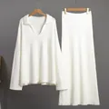 Front view of elegant white two-piece knitted set featuring V-neck sweater and long skirt - S / Top And Bottom / White