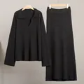 Elegant black two-piece knit set featuring V-neck sweater and matching long maxi skirt - S / Top And Bottom / Black