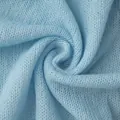Detailed macro view showing the soft texture and weave of light blue mohair knit fabric - S / Tops / Light Blue