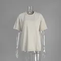 Washed vintage short-sleeved T-shirt with relaxed fit on transparent mannequin - Apricot
