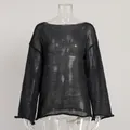 Macro view of sheer black hollow knit texture and flared sleeve detail on sweater - S / Tops / Black