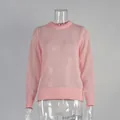 Detail view of pink semi-transparent crew neck mohair knit sweater on a mannequin - S / Tops / Pink
