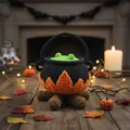 Cozy handmade crochet Halloween cauldron decor with orange flames on a wooden table - Halloween Cauldron Fire Design