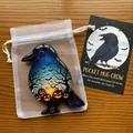 Handcrafted crow-shaped pocket hug token with Halloween pumpkin design and message card. - Crow