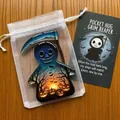 Macro view of Halloween Pocket Hug Grim Reaper acrylic token with card and organza bag - Grim Reaper