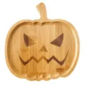 Detailed macro view of natural bamboo grain on a carved Halloween pumpkin face tray - Pumpkin