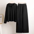 Detalle de un conjunto de punto negro con jersey de cuello polo y pantalón de pierna ancha - S / Top y Pantalones / Negro