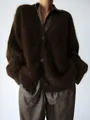 Close-up of oversized dark brown faux mink fur cardigan with a soft, fuzzy texture - S / Brown