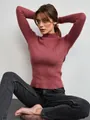 Detail view of a woman wearing a mauve ribbed mock neck sweater for autumn fashion style - One Size / Tops / Brick Red