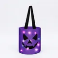 Detailed view of glowing Halloween candy bucket with spooky jack-o'-lantern face - Style C (Purple Pumpkin)