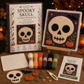 Detailed view of Halloween DIY fabric weaving kit including yarn, tools, and spooky skull pattern. - Skull