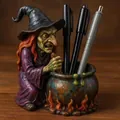 Detailed view of a spooky resin witch stirring a cauldron pen holder on a wooden desk - Witch Pen Holder