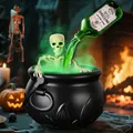 Close-up of Halloween witch cauldron decoration with glowing green liquid and skeleton prop - Medium (25cm) with 40cm Skull