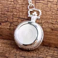 Detailed macro view of the silver vintage pocket watch back with floral engraving - Silver