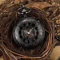 Macro detail of a vintage black mechanical pocket watch with skeleton dial and Roman numerals - Gunmetal