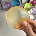 Jouet de décompression squishy jaune citrouille semi-transparent pour la relaxation - Balle à l'Huile de Coco Haute Translucide / Jaune