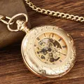 Detailed view of vintage gold hollow mechanical pocket watch with Roman numerals - Gold