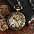 Detail view of a vintage bronze mechanical pocket watch with hollow sun-carved flip cover - Bronze Style (PM068)