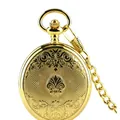 Detailed view of classic vintage gold pocket watch featuring intricate floral engravings - Bright Gold