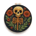 Macro detail of hand-crafted skull and floral embroidery on a dark background - Skull And Flowers (Style G)