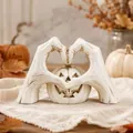 Detail view of a white skeleton hand heart-shaped Halloween pumpkin tabletop ornament - Heart Hands Skeleton Pumpkin Style / Ivory