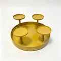 Macro view of a four-cup gold iron candle holder centerpiece for Christmas table decor - Gold
